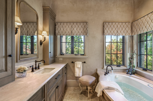 Patterned box pleat valances above windows in a bathroom with a tub
